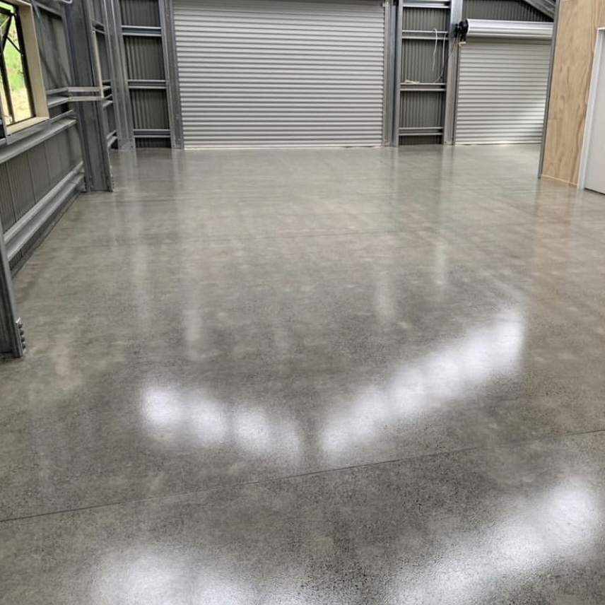 Concrete floor with two roller doors with a grind and seal floor finish by nz grinders
