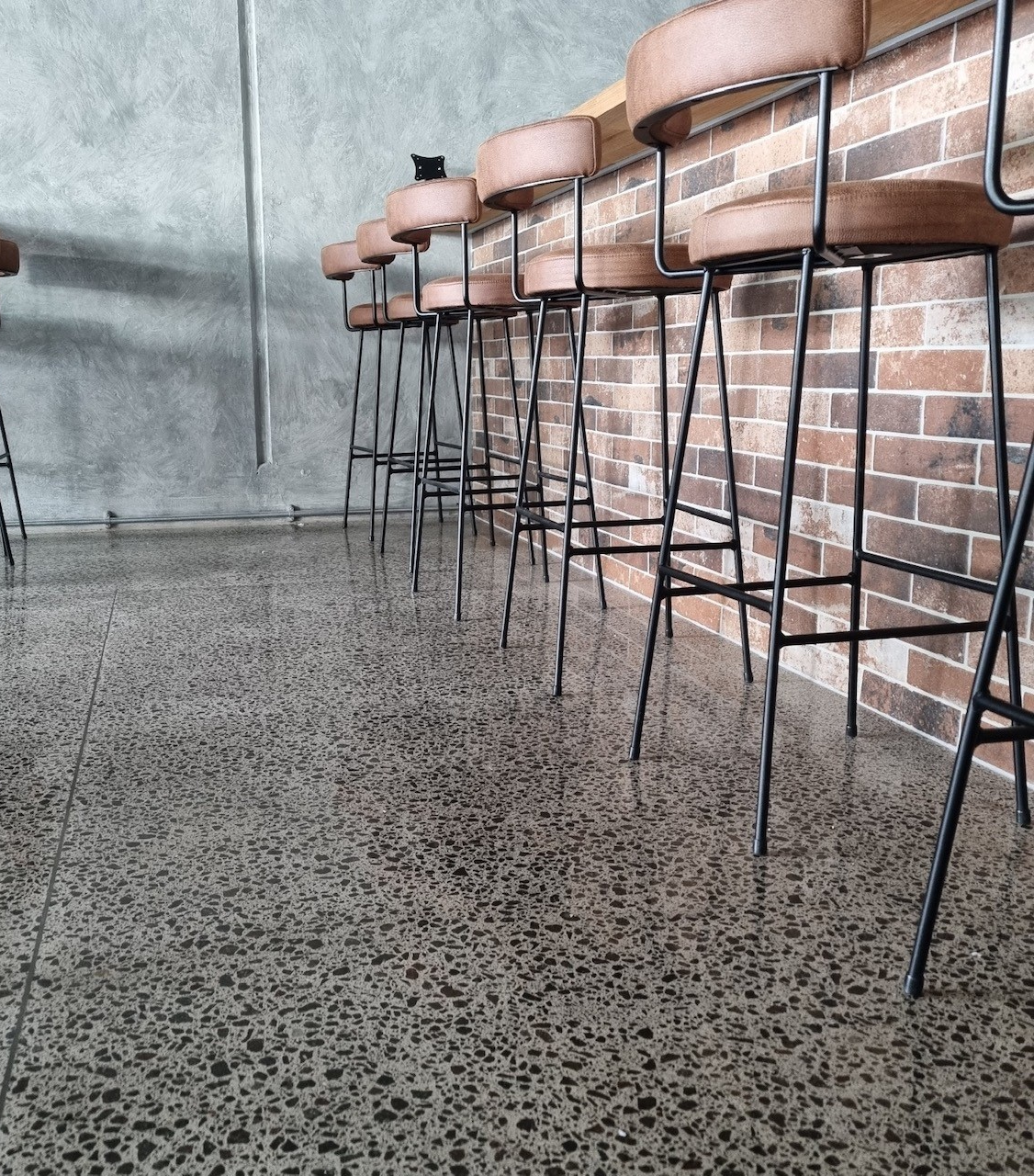Full stone exposure floor image at saltwater restaurant floor high gloss mt maunganui