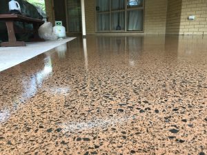 close up of a patio with terracotta concrete floor and full stone exposure