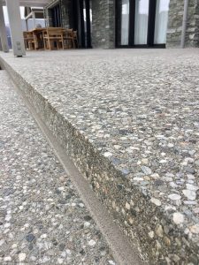 close up of external steps on a patio with full stone exposure and a bush hammer finish