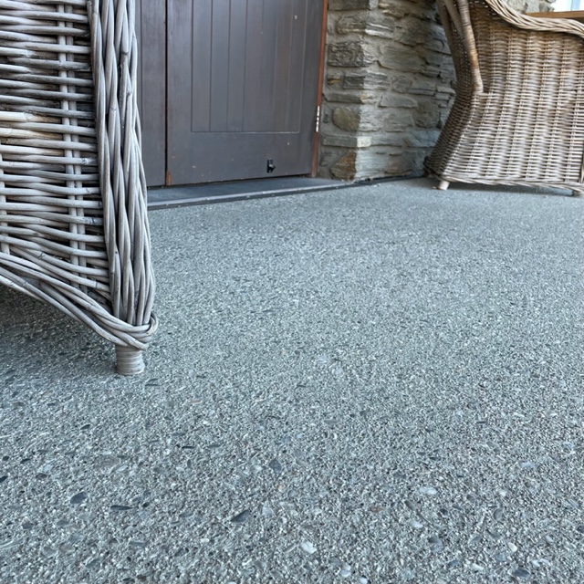 bush hammered external patio in front of a door at cardrona distillery