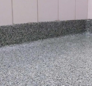 Flake flooring coving edge with grey and white flakes
