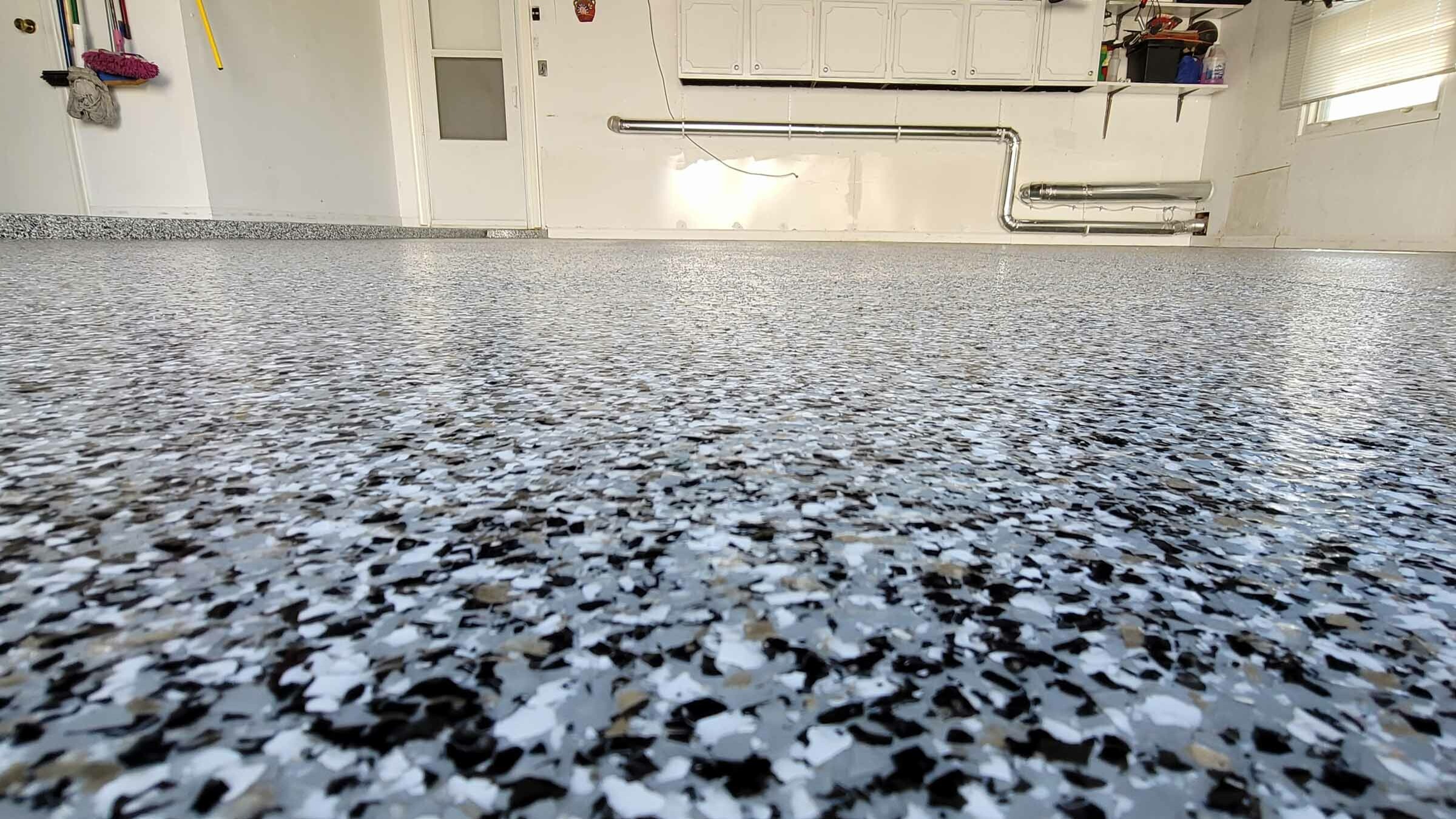 grey white black vinyl flake floor in utility room
