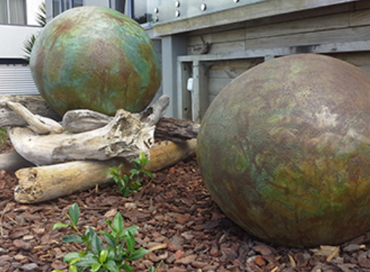 chemical stain for concrete floor nz grinders tauranga garden chemical stain applied to garden concrete balls 2 shown in garden in green brown mottled shades