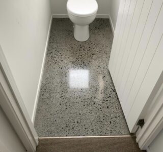 Toilet floor polished concrete grind and seal