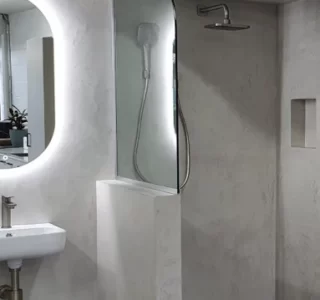 Micro topping in bathroom by NZ Grinders Polished concrete