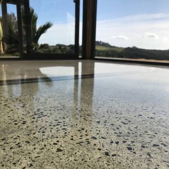 concrete floor with exposed stone